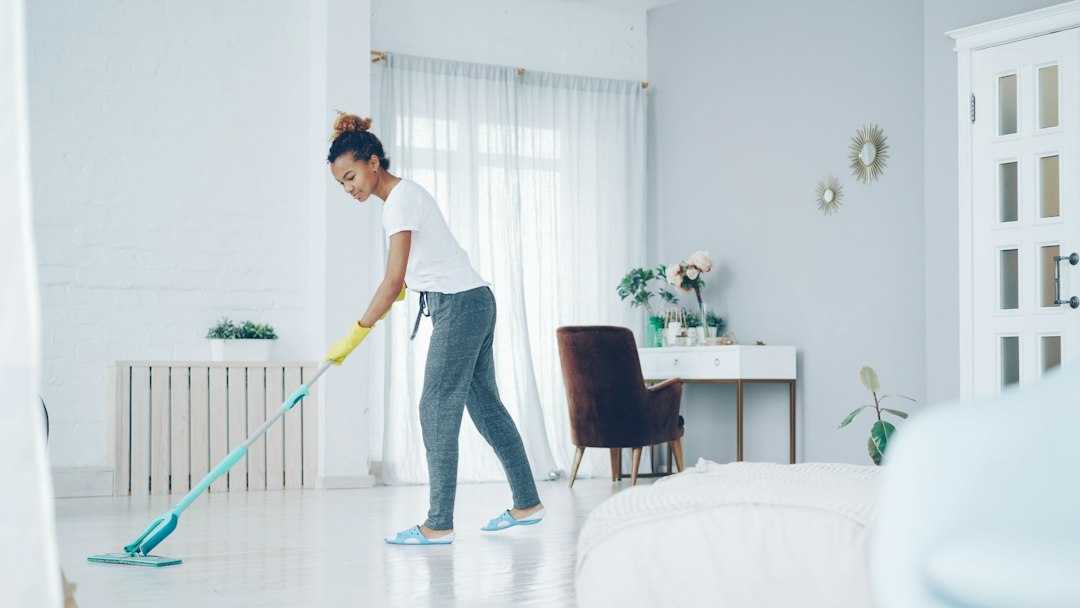 Professional cleaner completing spring cleaning in a Gold Coast home